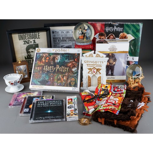 121 - Harry Potter memorabilia to include: The History of Magic snow globe; boxed Rubeus Hagrid figure; Ha... 