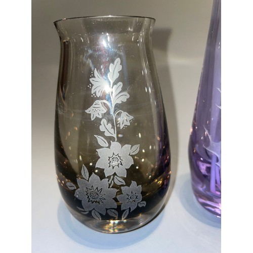 134 - A collection of Caithness etched plain and coloured glass vases to include: Romeo & Juliet from Shak... 