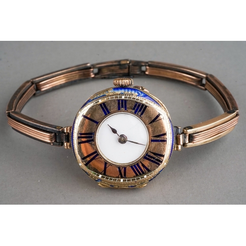 149 - A ladies 9ct gold wristwatch, circular white enamel dial, Roman numerals to outer gold bezel, on a 9... 