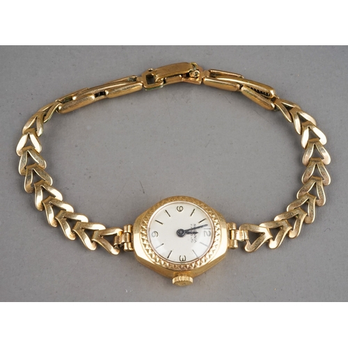 150 - A ladies 9ct yellow gold case wristwatch, with a rolled gold bracelet strap