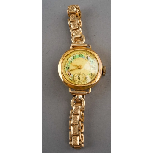 153 - A ladies gold-plated wristwatch, circa 1930s, on a rolled gold bracelet strap