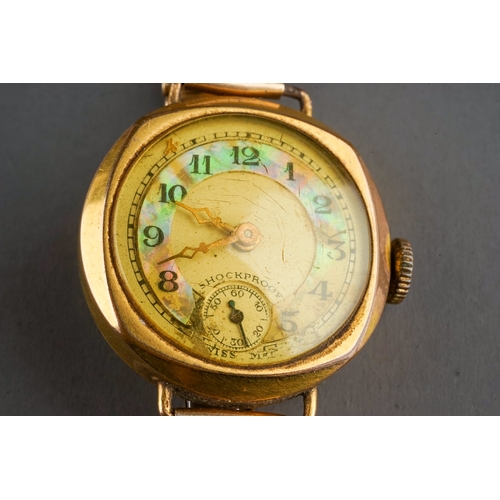 153 - A ladies gold-plated wristwatch, circa 1930s, on a rolled gold bracelet strap