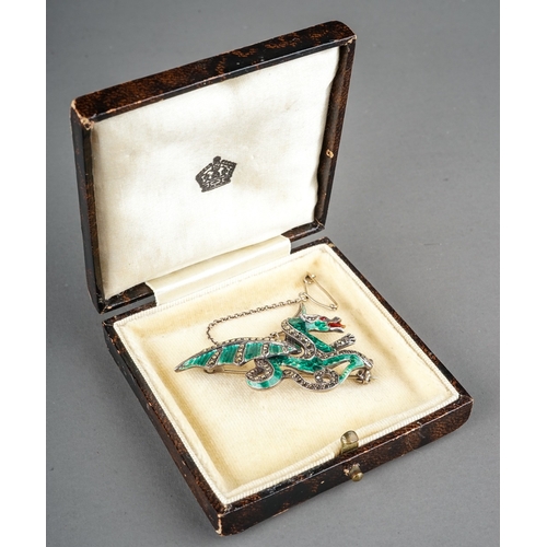 226 - A silver and enamel brooch, in the form of a dragon, green enamelled body, marcasite set wings and t... 