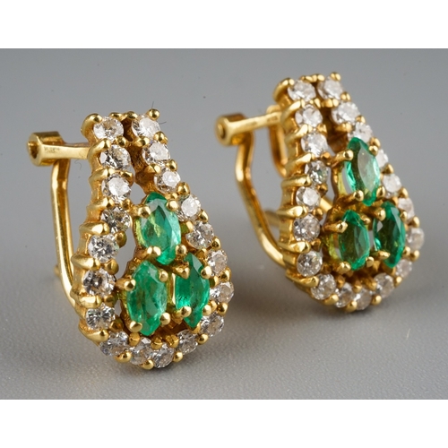 227 - A pair of 18k yellow gold diamond and emerald earrings, each set with three marquise-cut emeralds wi... 