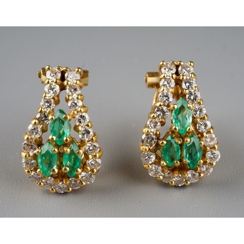 227 - A pair of 18k yellow gold diamond and emerald earrings, each set with three marquise-cut emeralds wi... 