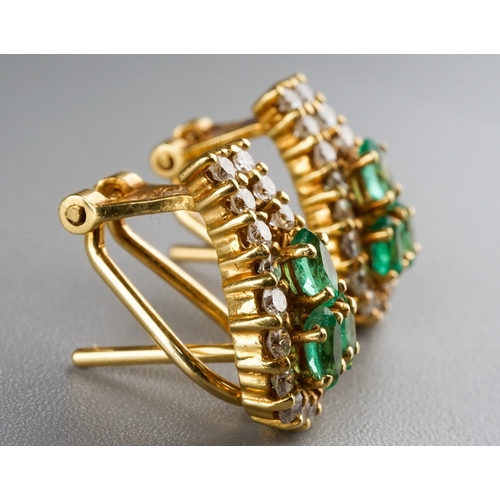 227 - A pair of 18k yellow gold diamond and emerald earrings, each set with three marquise-cut emeralds wi... 