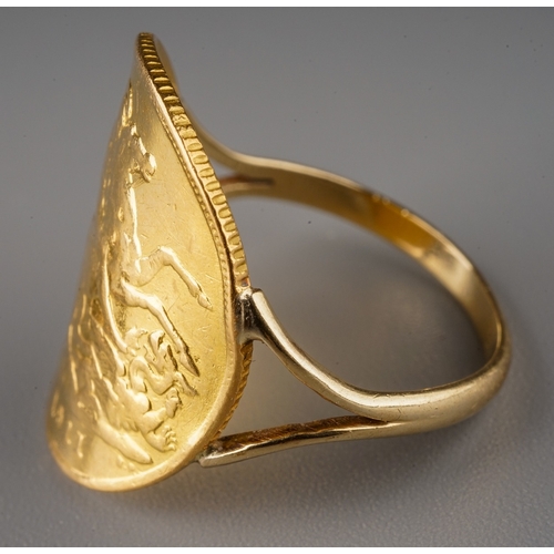 229 - A yellow gold ring, set with a 1911 half sovereign mounted on an unmarked yellow gold shank, size N1... 