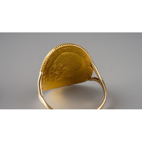 229 - A yellow gold ring, set with a 1911 half sovereign mounted on an unmarked yellow gold shank, size N1... 