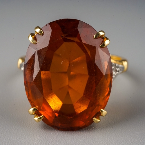 230 - An 18ct yellow gold citrine and diamond dress ring, set with an oval cut citrine in claw settings, d... 