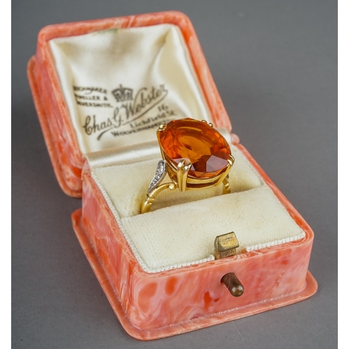 230 - An 18ct yellow gold citrine and diamond dress ring, set with an oval cut citrine in claw settings, d... 