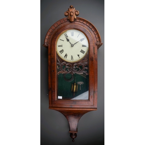 253 - A late 19th century mahogany cased drop case wall clock, the arched top with central cresting, paint... 