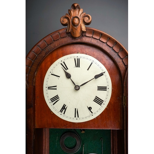 253 - A late 19th century mahogany cased drop case wall clock, the arched top with central cresting, paint... 