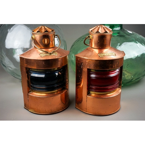 262 - Two reproduction copper ships lights  and two glass carboys (4)