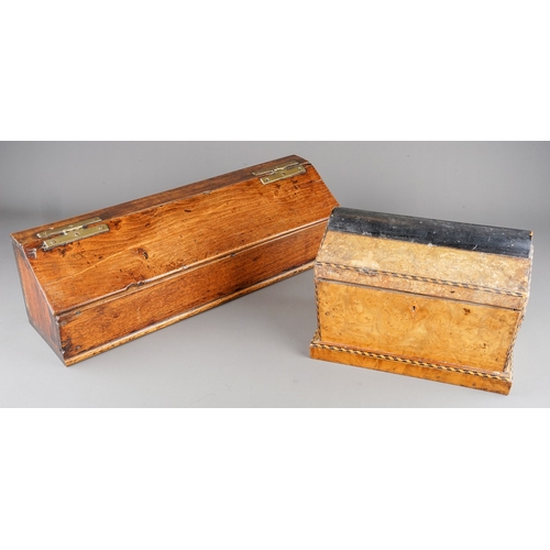 576 - An early 19th century oak and stained pine candle box of rectangular form with sloped hinged lid and... 