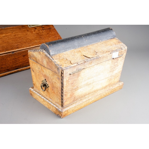 576 - An early 19th century oak and stained pine candle box of rectangular form with sloped hinged lid and... 