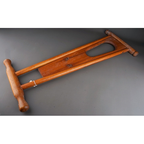 578 - A mid 20th century beech and pine folding boot pull, closed height 85cm