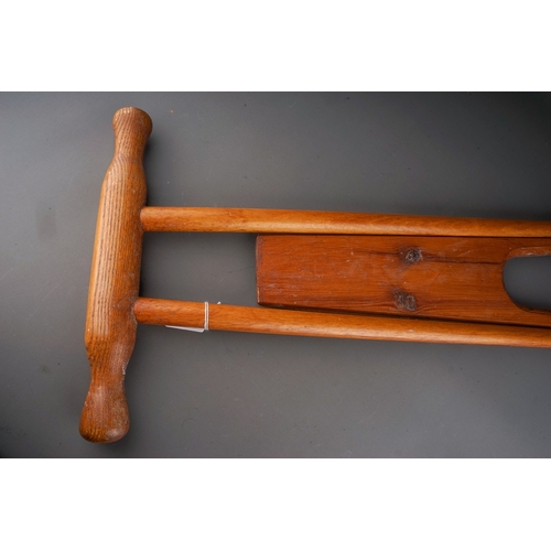 578 - A mid 20th century beech and pine folding boot pull, closed height 85cm