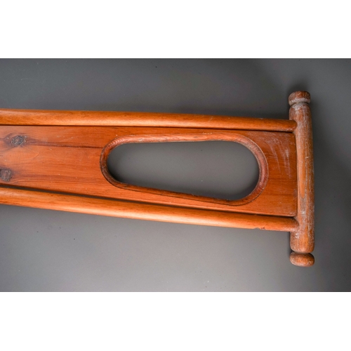 578 - A mid 20th century beech and pine folding boot pull, closed height 85cm