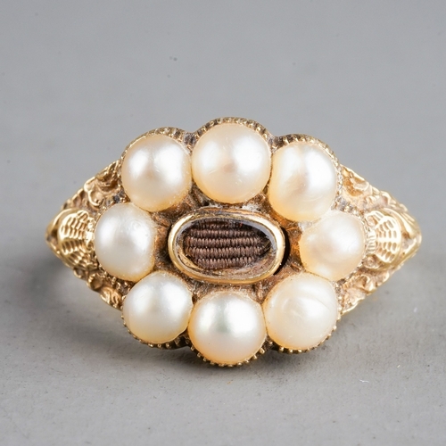 585 - A 19th century gold and pearl mourning ring, set with eight pearls surrounding a plait of hair, chas... 