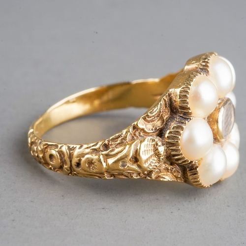 585 - A 19th century gold and pearl mourning ring, set with eight pearls surrounding a plait of hair, chas... 