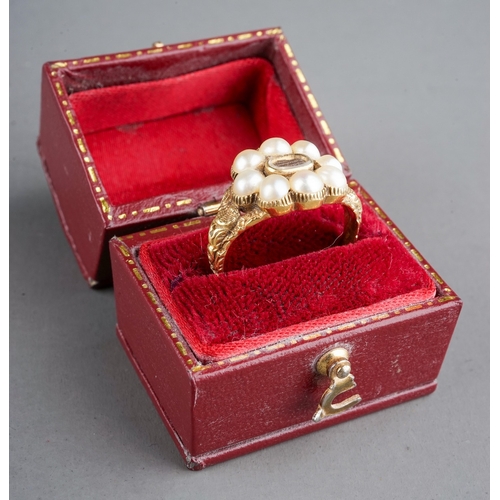 585 - A 19th century gold and pearl mourning ring, set with eight pearls surrounding a plait of hair, chas... 