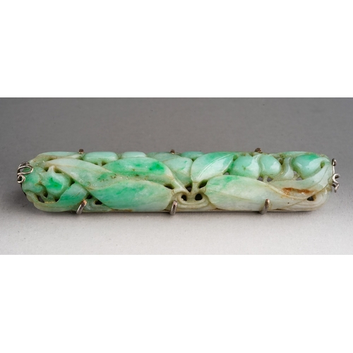 586 - An Art Deco jade rectangular brooch, pierced jade depicting fruit and foliage, set in white metal, a... 