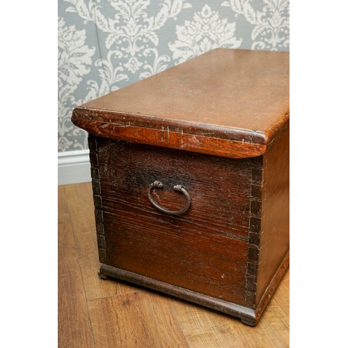 592 - A Victorian stained pine blanket chest with hinged cover, dove tail construction with brass escutche... 