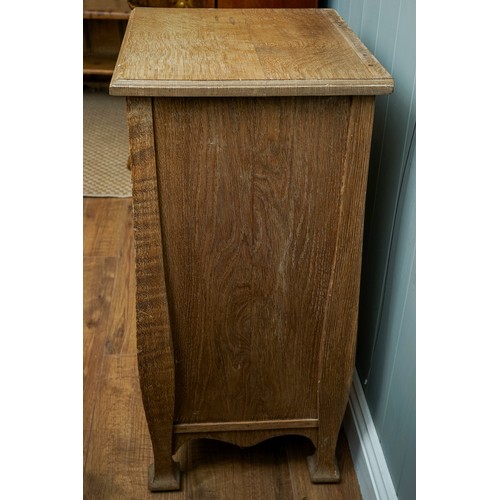 594 - An Arts & Crafts pine cabinet, single door, drop handle on shaped supports, approx 77cm high