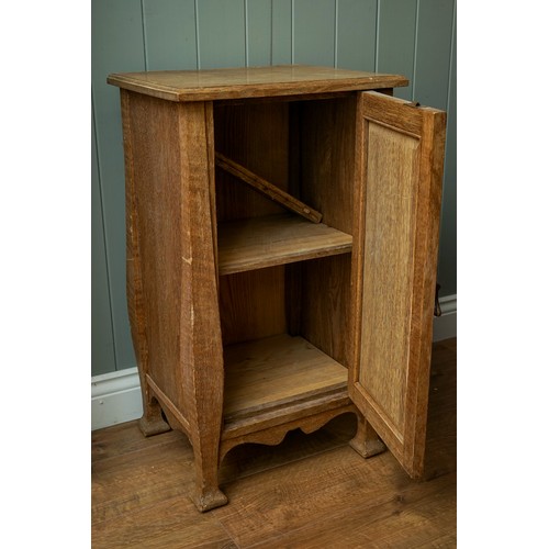 594 - An Arts & Crafts pine cabinet, single door, drop handle on shaped supports, approx 77cm high