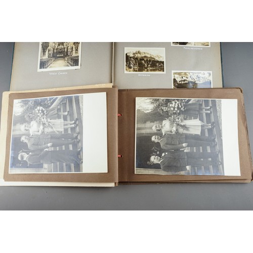 610 - A 1930s photograph album containing topographical black and white photographs, postcards etc of SS B... 