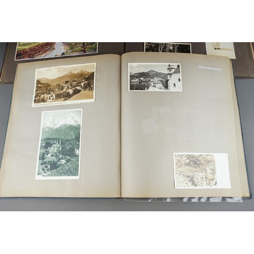 610 - A 1930s photograph album containing topographical black and white photographs, postcards etc of SS B... 