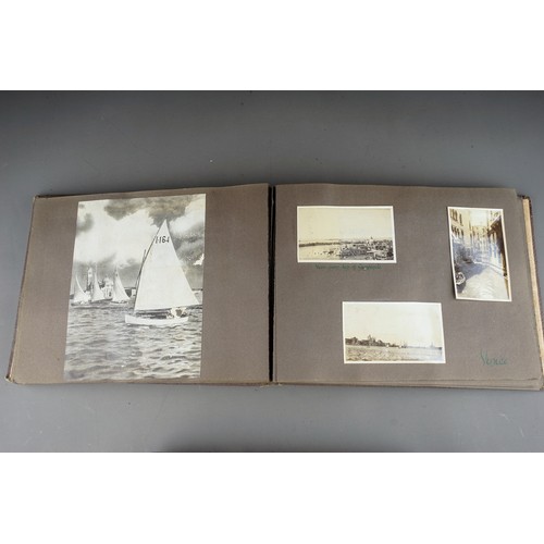 610 - A 1930s photograph album containing topographical black and white photographs, postcards etc of SS B... 