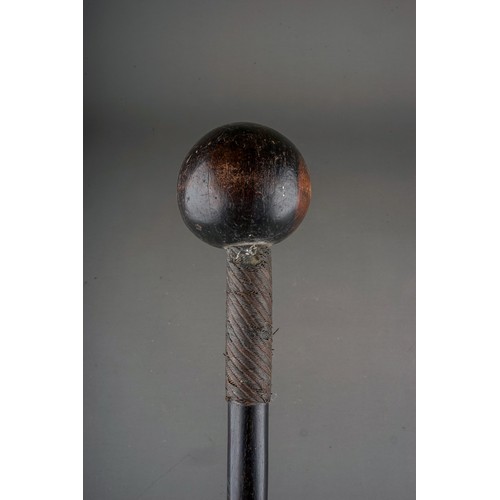 614 - An African Zulu warrier hardwood knobkerrie \ throwing club, wire bound to upper, mid and lower sect... 