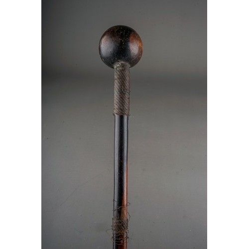 614 - An African Zulu warrier hardwood knobkerrie \ throwing club, wire bound to upper, mid and lower sect... 