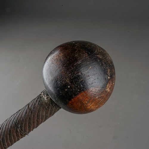 614 - An African Zulu warrier hardwood knobkerrie \ throwing club, wire bound to upper, mid and lower sect... 