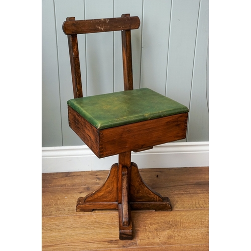 621 - Child's swivelling chair with a lift up leatherette covered lid