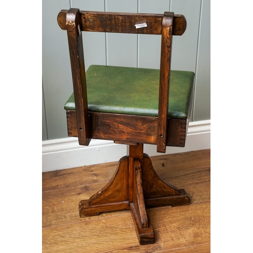 621 - Child's swivelling chair with a lift up leatherette covered lid