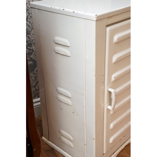 622 - A 1930's painted metal medical cabinet, the single door with horizontal ribbing enclosing three shel... 