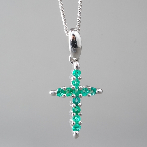 10 - A 9ct white gold and emerald crucifix pendant necklace, set with round-cut emeralds, approx 18mm, on... 