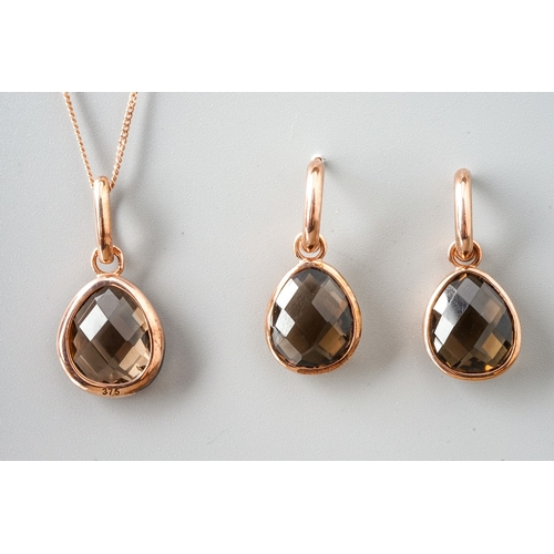 13 - A 9ct rose gold and smoky quartz pendant, on a fine chain; together with a pair of matching earrings... 