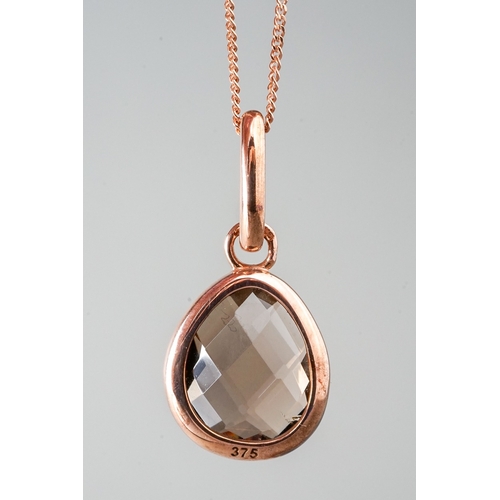 13 - A 9ct rose gold and smoky quartz pendant, on a fine chain; together with a pair of matching earrings... 