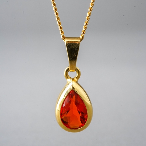 14 - An 18ct yellow gold and fire opal pendant, on a fine chain, total gross weight approx 3g