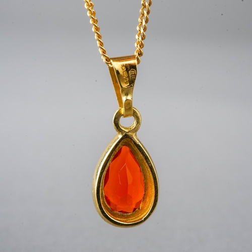 14 - An 18ct yellow gold and fire opal pendant, on a fine chain, total gross weight approx 3g