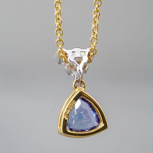 15 - An 18ct yellow gold tanzanite and diamond pendant necklace, set with a triangular-mixed cut tanzanit... 