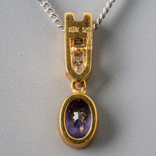 17 - An 18ct yellow and white gold tanzanite and diamond pendant necklace, set with an oval-cut tanzanite... 