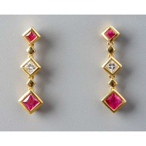 18 - A pair of 18ct yellow gold ruby and diamond drop earrings, post and butterfly fittings, total gross ... 