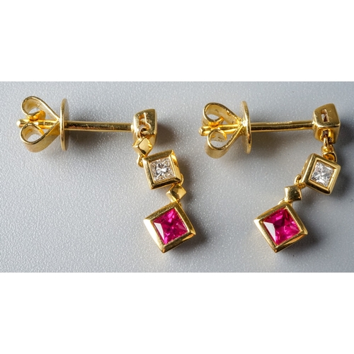 18 - A pair of 18ct yellow gold ruby and diamond drop earrings, post and butterfly fittings, total gross ... 