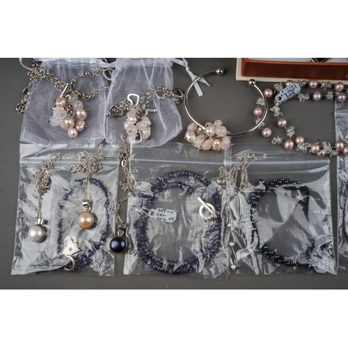 19 - A good group of costume jewellery, including faux pearls, silver earrings, necklaces, pendants, bang... 