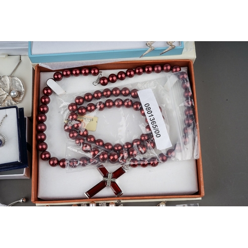 19 - A good group of costume jewellery, including faux pearls, silver earrings, necklaces, pendants, bang... 