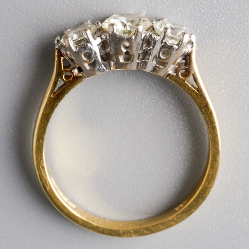 23 - An 18ct yellow gold and diamond three-stone ring, the central round brilliant-cut diamond approx 0.5... 